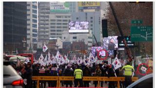 서울 시내 한복판 일장기 등장 사진 합성으로 밝혀짐